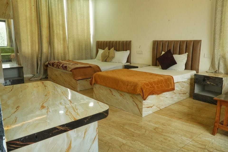 Family Triple Room, Courtyard View | Desk, laptop workspace, soundproofing