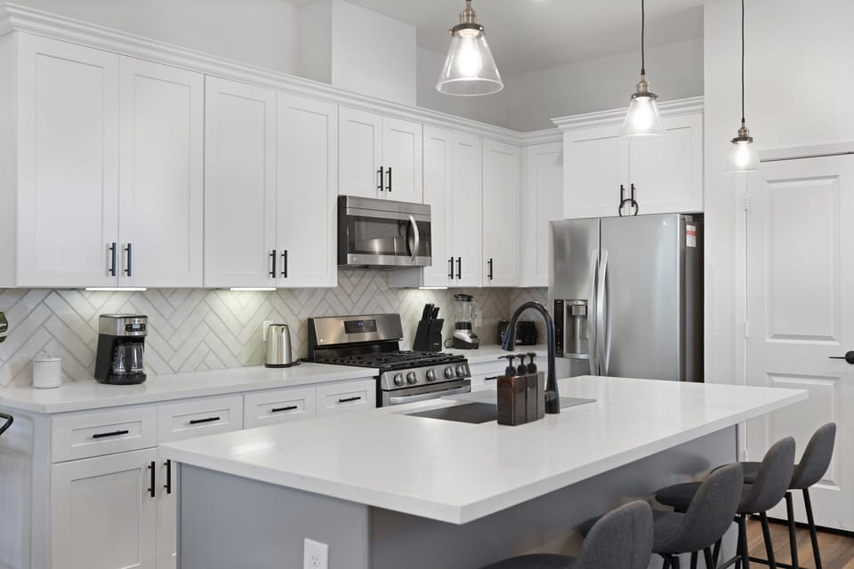 Gourmet Kitchen: Sleek appliances and chic design invite culinary adventures with friends and family!