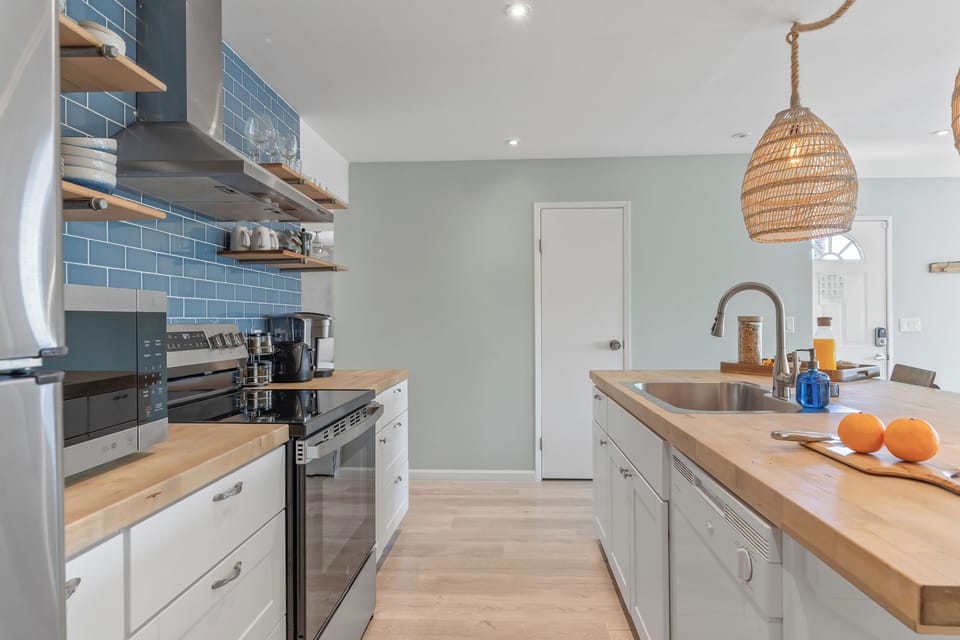 Chef-ready kitchen with stainless steel appliances.