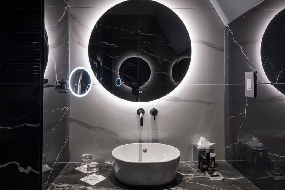 Combined shower/tub, designer toiletries, hair dryer, bathrobes