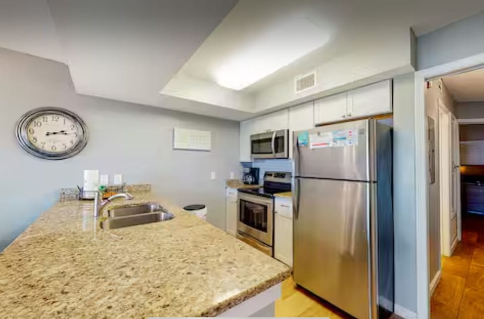 Well stocked kitchen with granite countertops