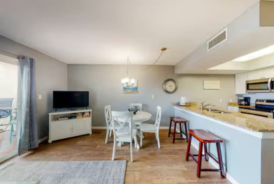 Open floor plan with seating the bar