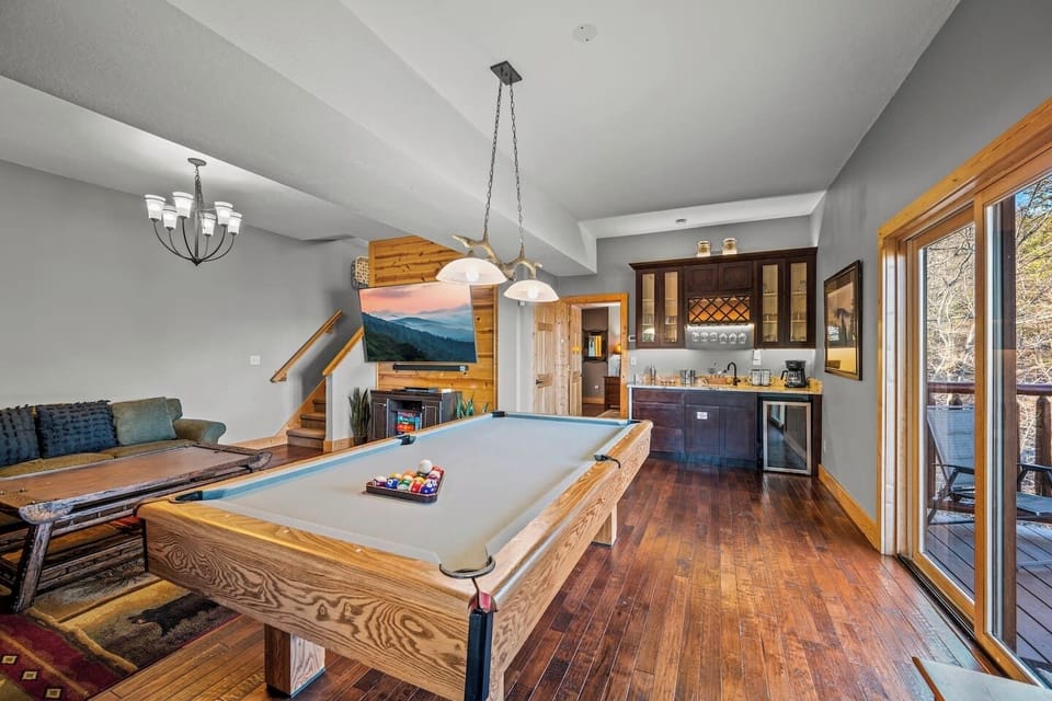 Challenge your group to a friendly billiard tournament before sinking into the comfortable couches for a movie night.