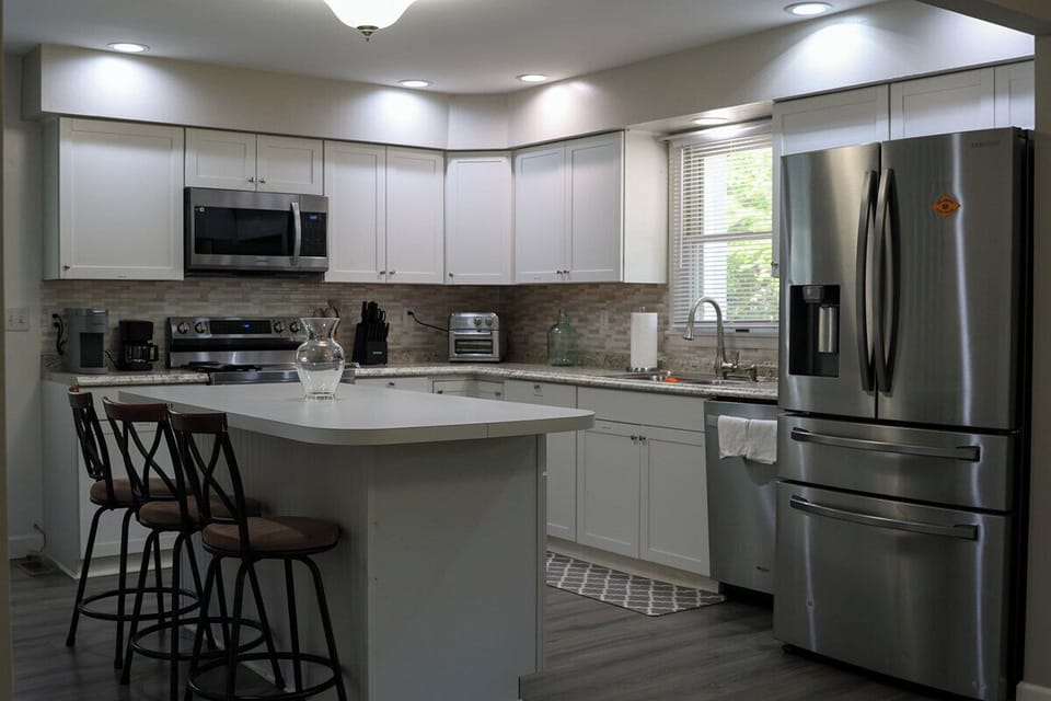 Fully equipped kitchen with stainless steel appliances.