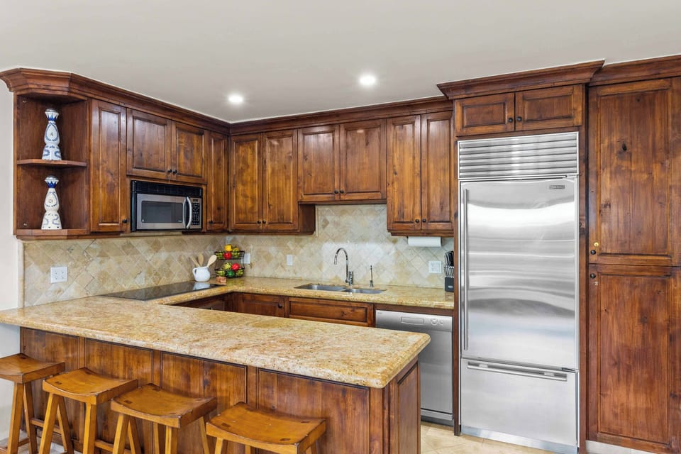 High end appliances with dishwasher and granite counter tops