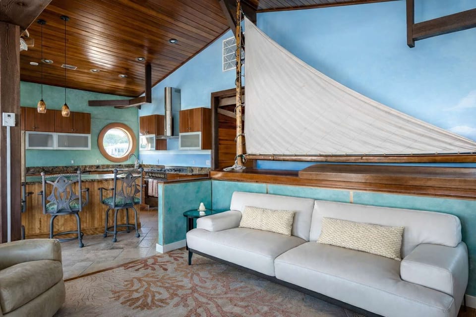 Inviting living space with soaring ceilings and water vistas