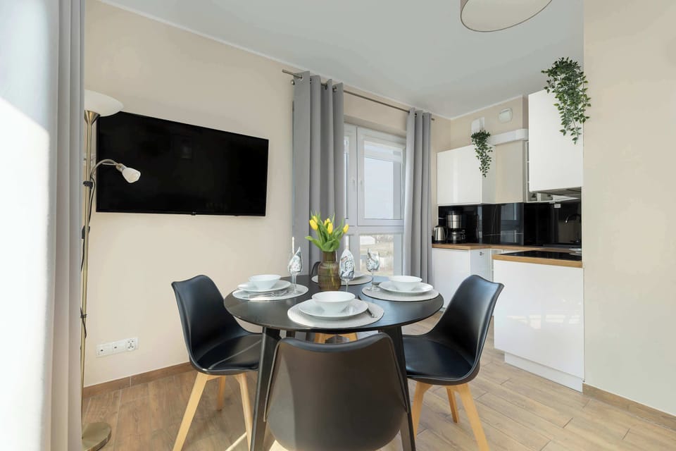 Bright kitchen with cooking utensils. 
