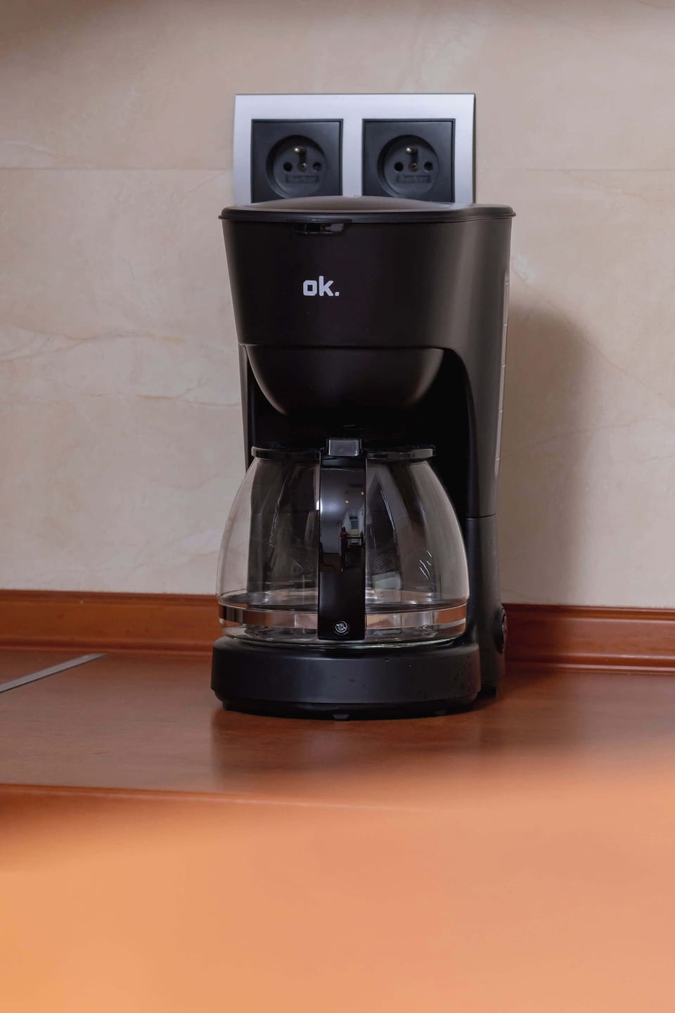 A coffee maker is ready for mornings with aromatic cappuccinos right at home.