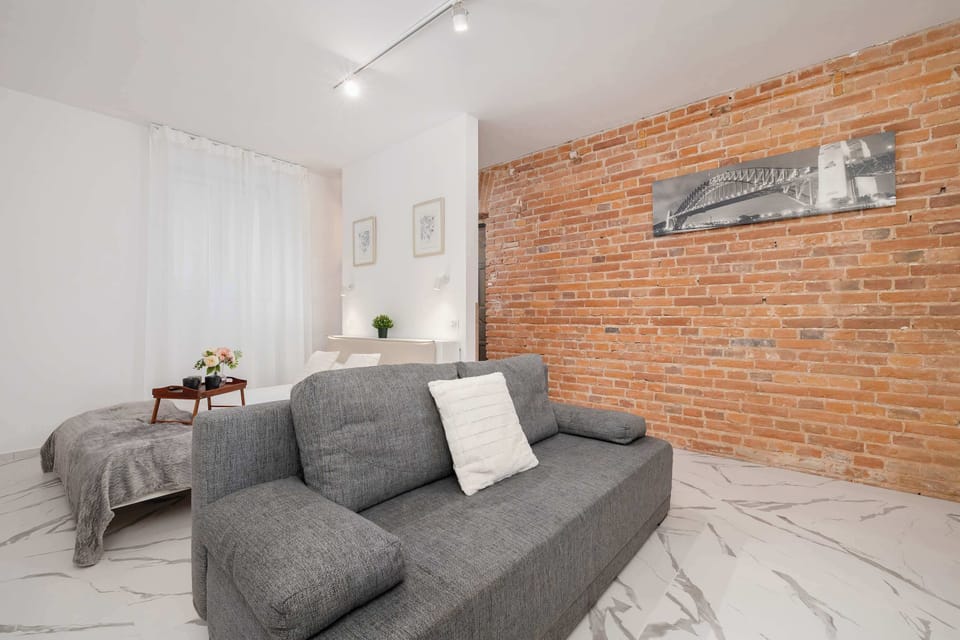 A comfortable sofa in the open living area invites you to unwind together.