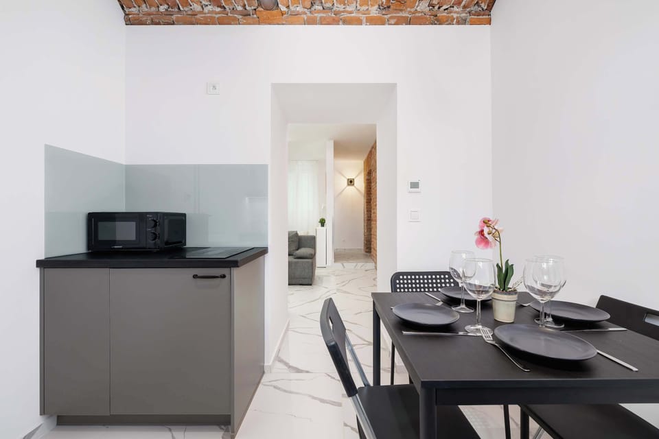 The view from the kitchen to the dining area and hallway highlights the cohesive style and functional layout.