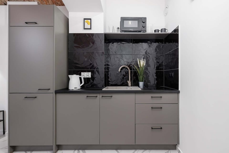 The built-in kitchen with a large fridge and modern appliances makes daily living easy.