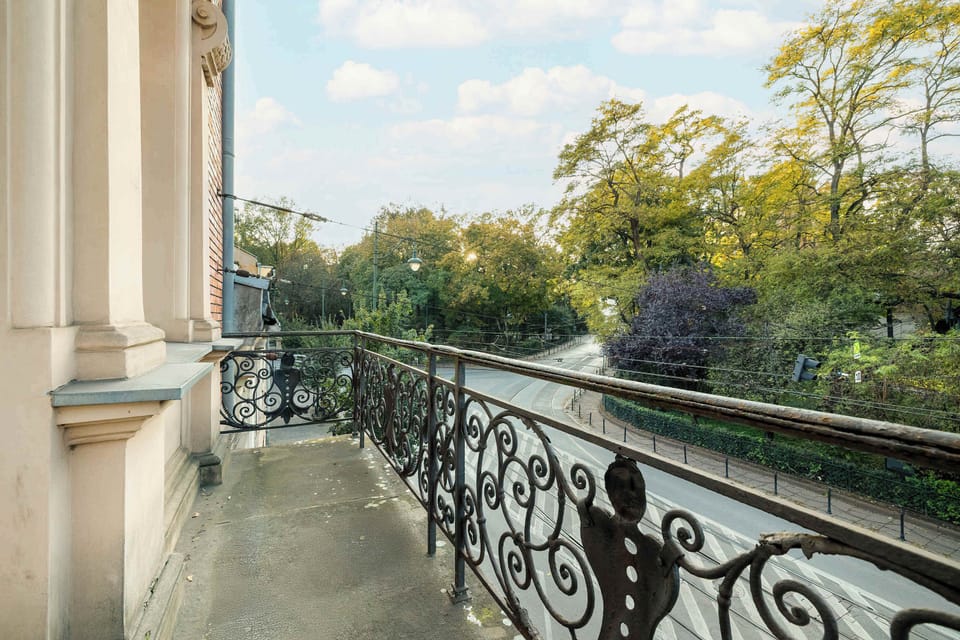 Classic balcony with a view of the green surrounding area.