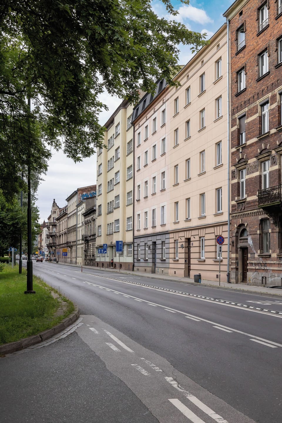 Street in front of the building, showing its classic Krakow architecture and convenient location.