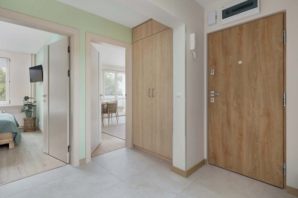 The entrance hallway with wooden accents and built-in storage.