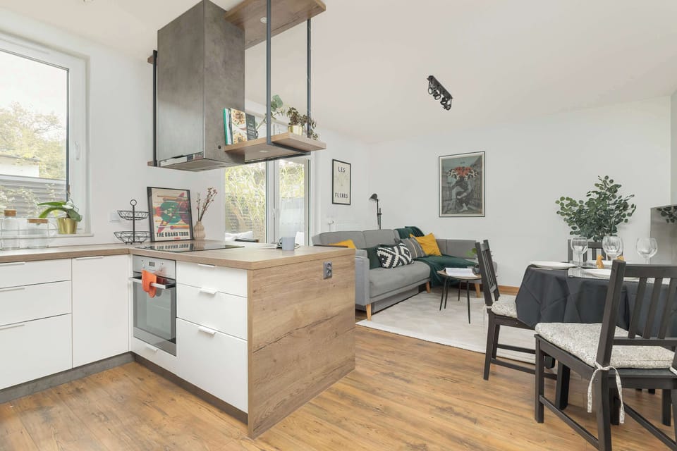 Fully equipped kitchenette with dining area and living room.