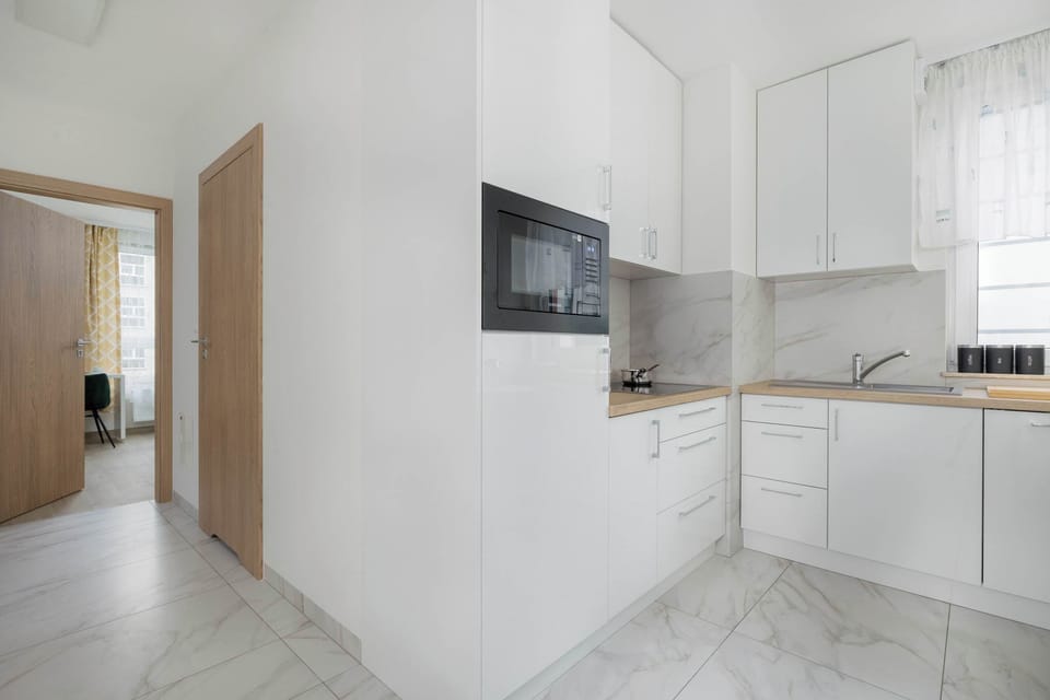 Kitchen is fully equipped to prepare delicious meals. Among other things, it contains an electric stove.