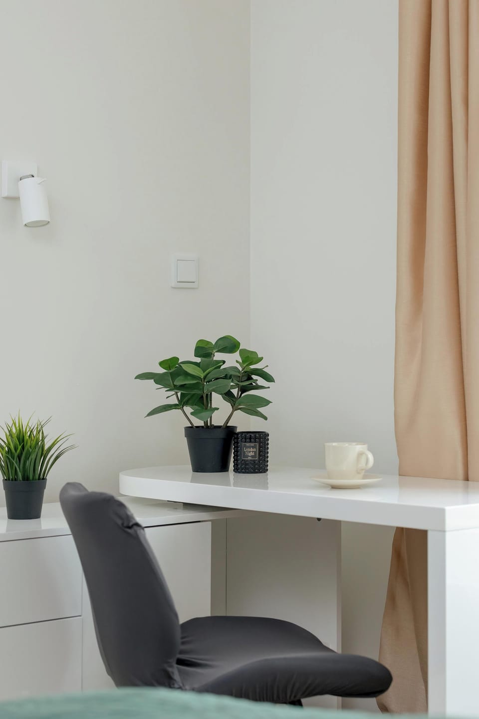 Remote work is very easy with a comfortable desk and a cup of a morning coffee.