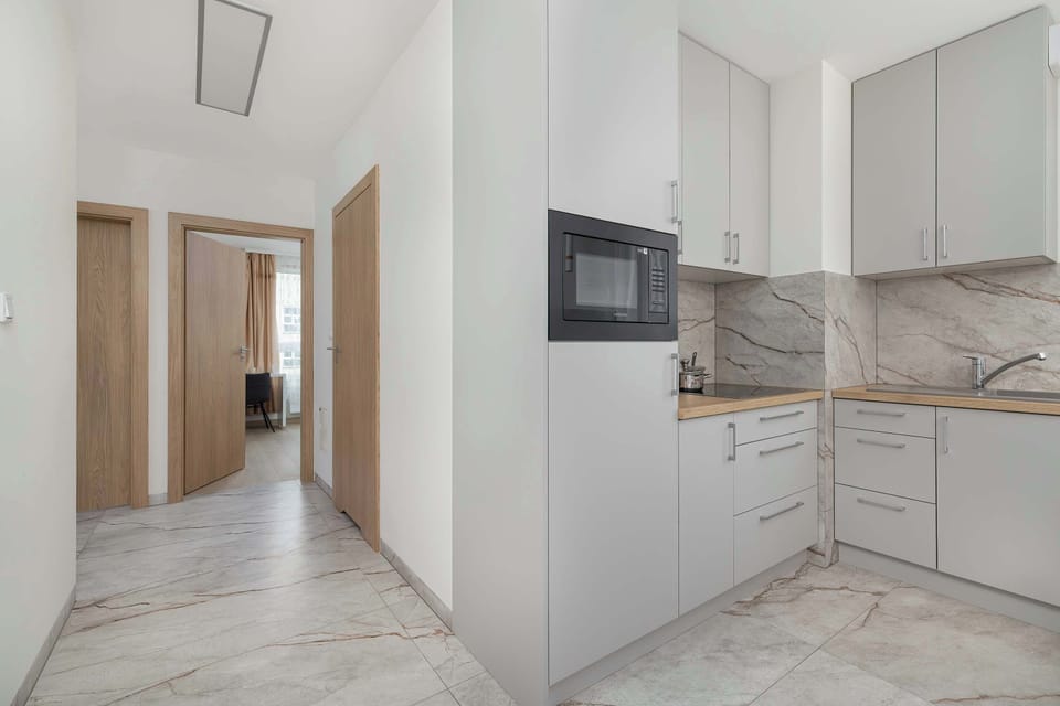 Kitchen is fully equipped to prepare delicious meals. Among other things, it contains an electric stove.