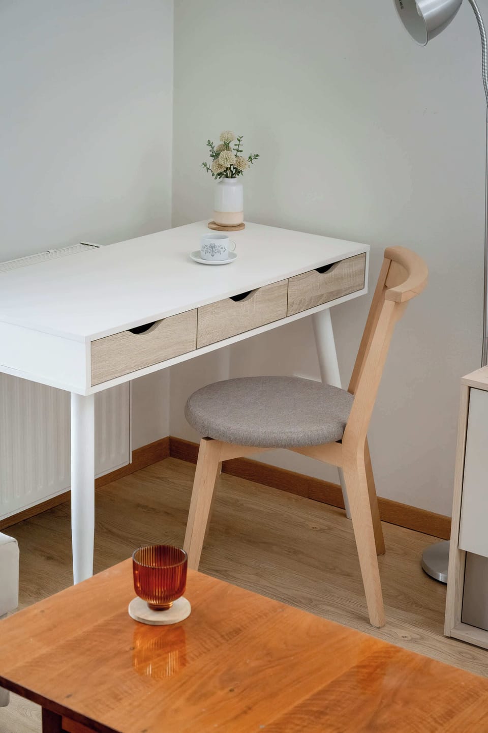 A small desk with a chair makes a perfect spot for remote work or a morning coffee.


