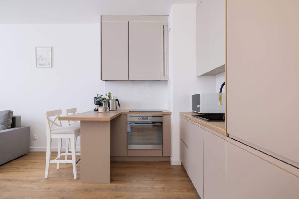 Cook and dine in style with the modern kitchenette and dining area.