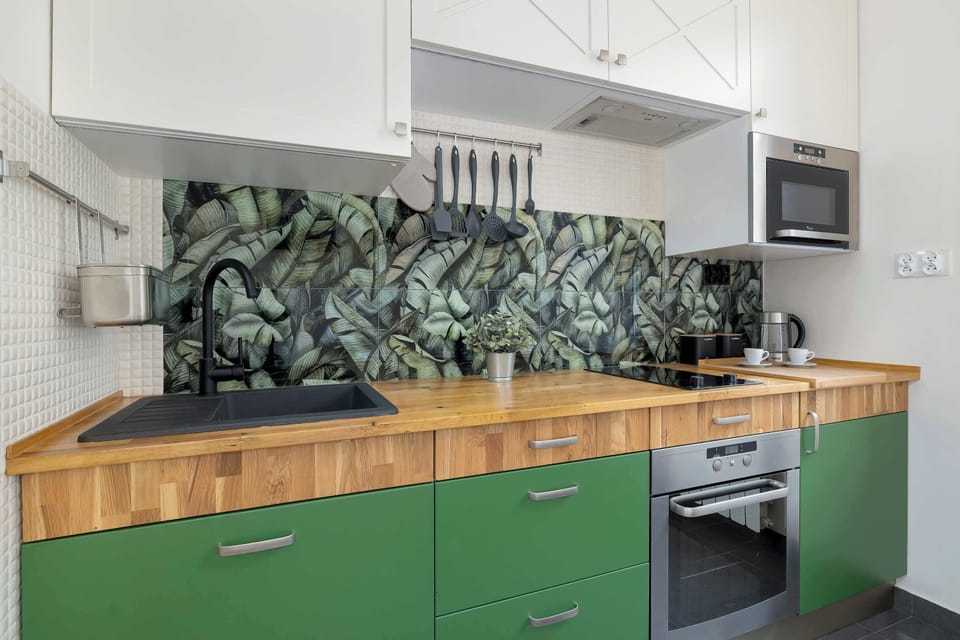 A close-up of the kitchen, featuring a coffee machine, electric kettle, and cups—perfect for a morning brew