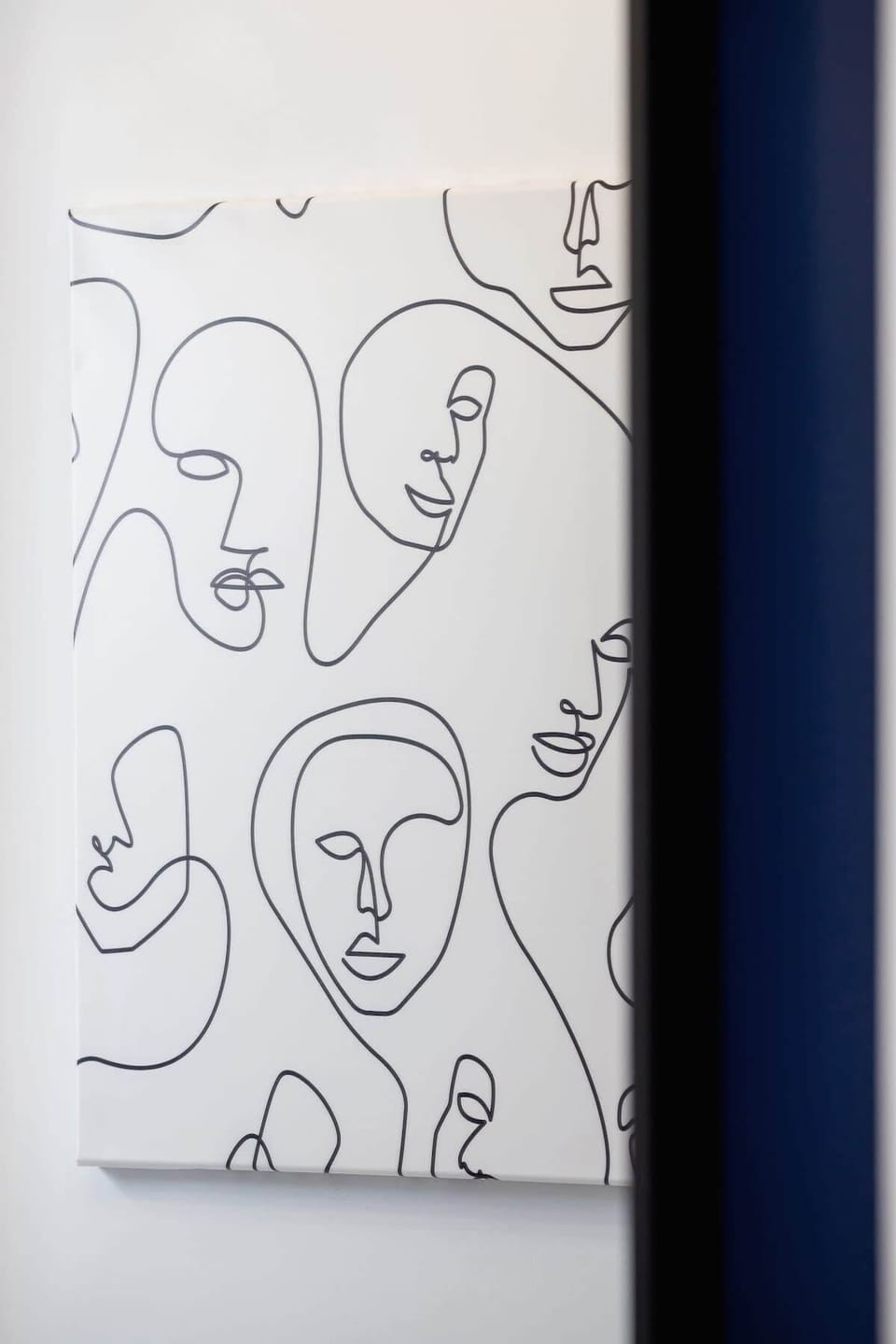 A detailed shot of a black and white abstract art piece, adding a modern touch to the room.