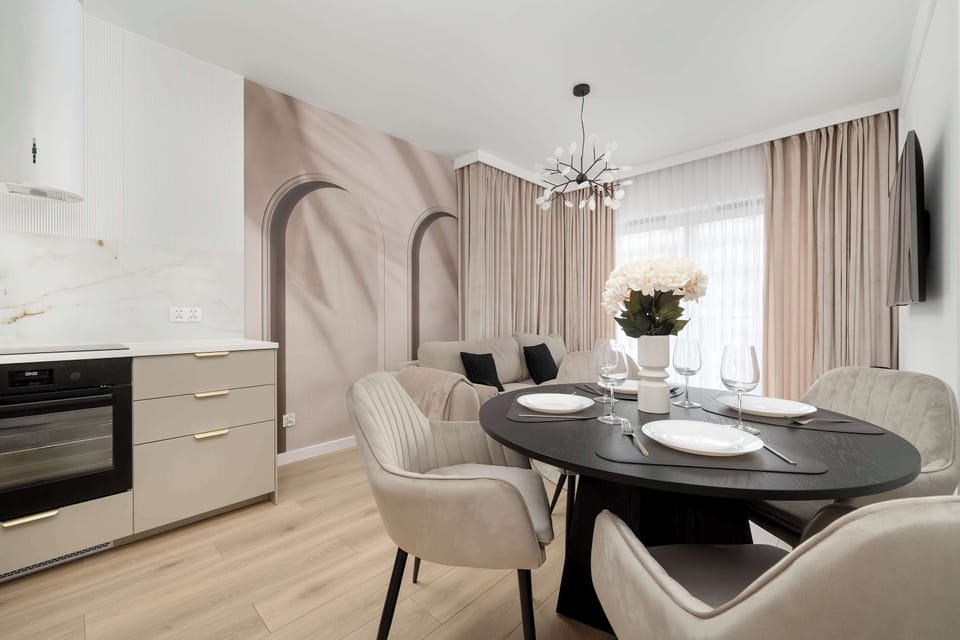 Elegant dining area and fully equipped kitchenette. The living room in the background.