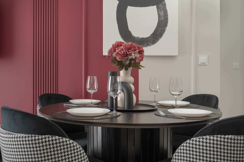 The living room's modern and stylish decor creates a welcoming atmosphere.
