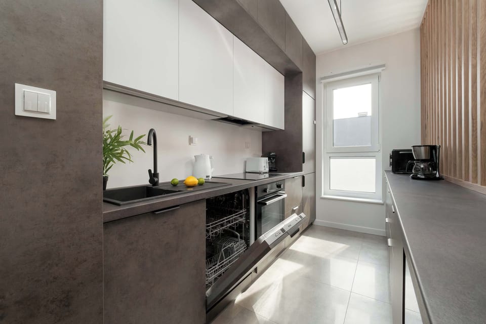 Kitchenette with oven and refrigerator.