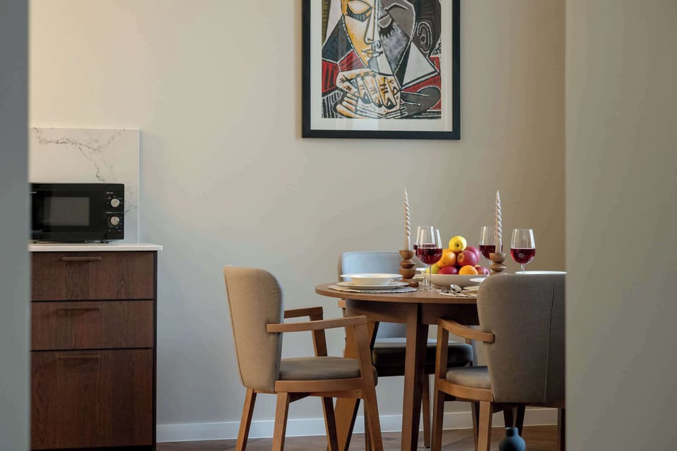 Large table with chairs for eating communal meals. 