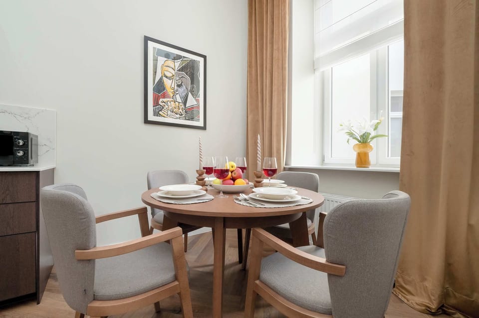 Large table with chairs for eating communal meals. 