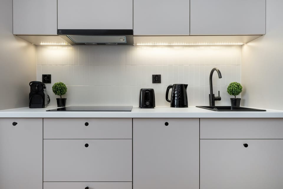 The fully equipped kitchenette includes everything you need for a home-cooked meal.