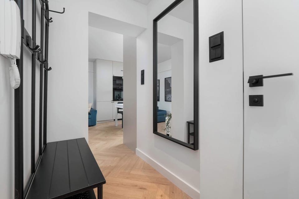 The living room's sleek design is both functional and aesthetically pleasing.