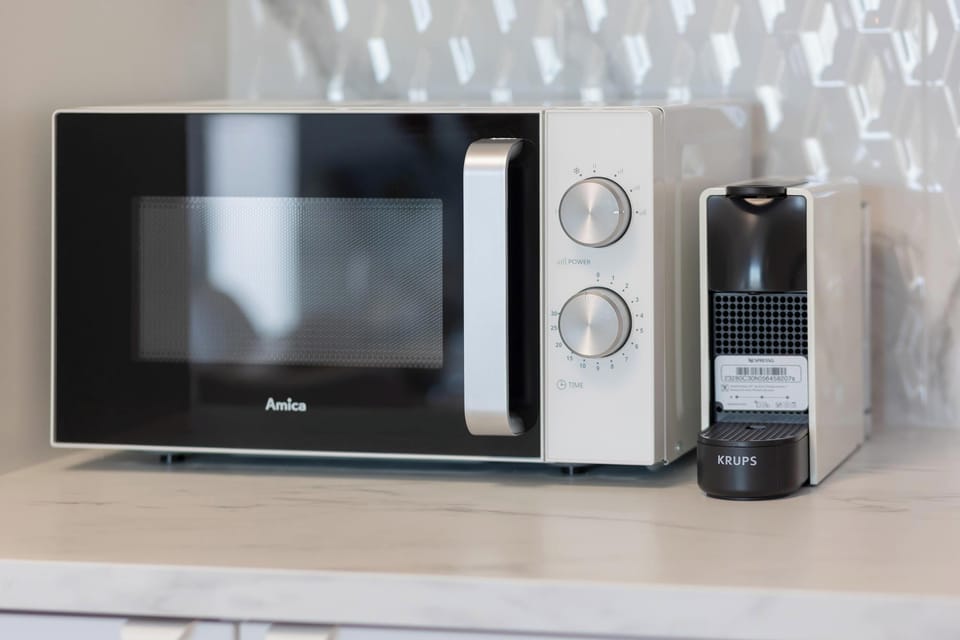 Kitchenette with a microwave.