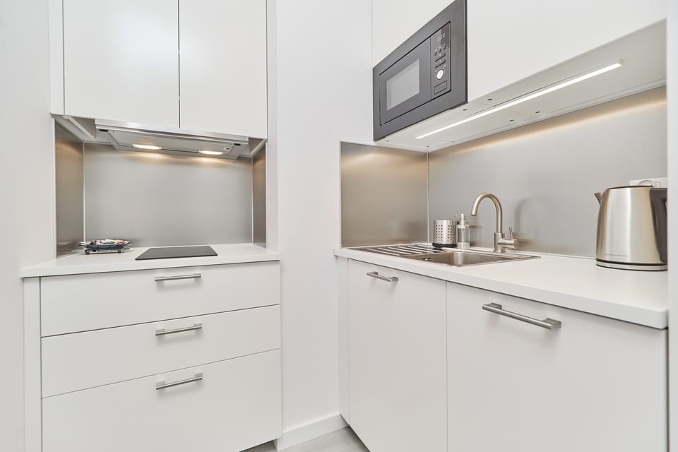 Kitchen with a modern design, light cabinetry, and essential appliances, blending practicality and style.
