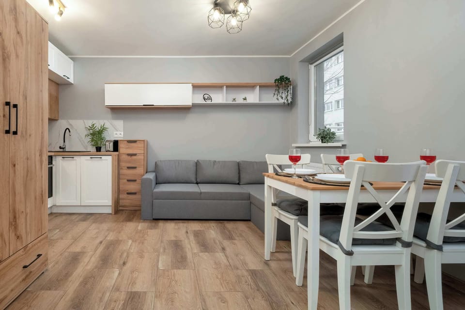 Relax in the stylish living area with a comfortable sofa and modern decor.