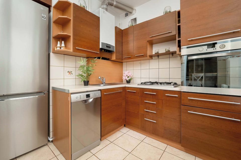 Kitchen with plenty of kitchen utensils and dishes. 
