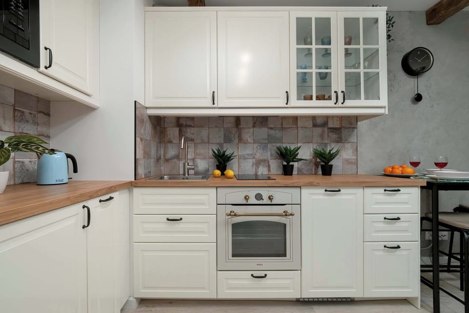 The sleek design of the kitchenette blending seamlessly with the living area.