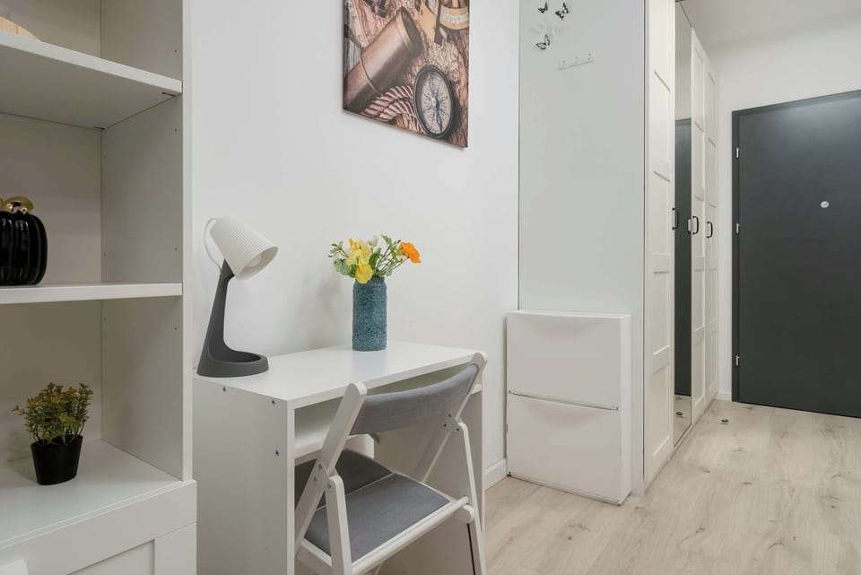 Relax in the stylish living area with a comfortable sofa and modern decor.