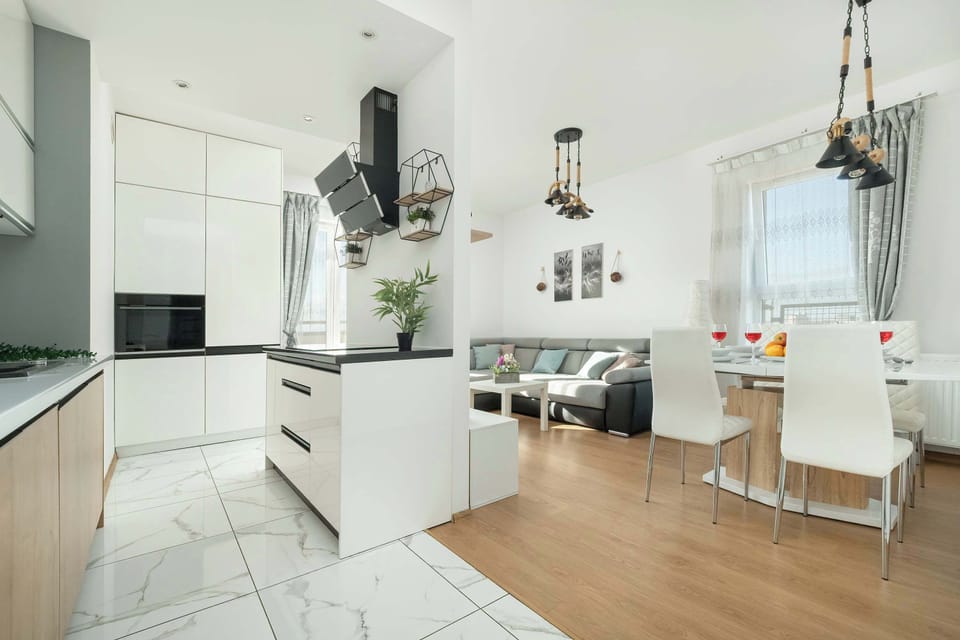 An open-plan space combining the living room and dining area, with stylish decor and modern furniture.