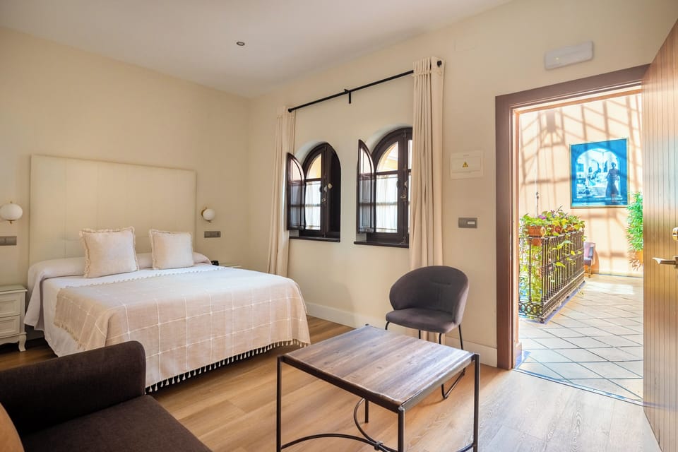 Double Room | Minibar, in-room safe, individually decorated, iron/ironing board