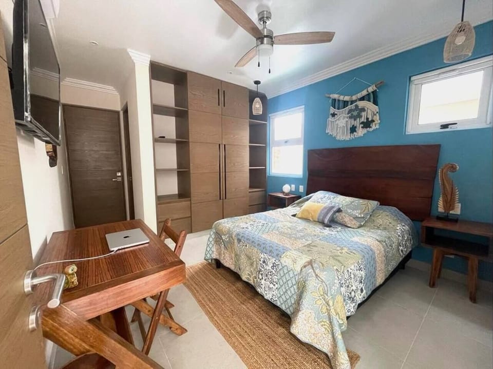 Cozy and functional: A room designed for comfort with a queen-size bed, entertainment at your fingertips with a TV, and a dedicated workspace for productivity. Your ideal sanctuary for relaxation and productivity awaits.