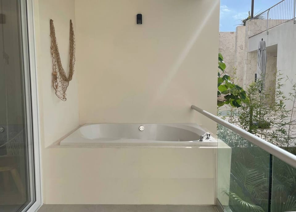 embark on a journey to serenity with your very own secluded jacuzzi, boasting a mesmerizing jungle panorama. Surrender to relaxation and opulence as you soak in the natural beauty that surrounds you. 