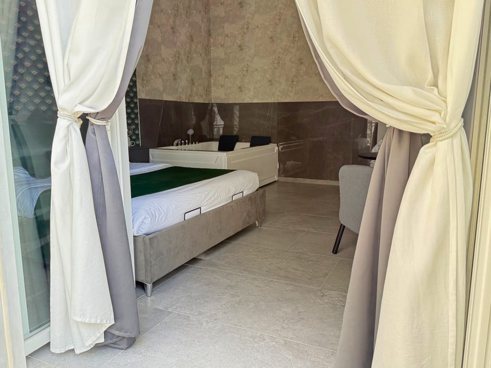 Luxury Double Room, Balcony, Courtyard View | Minibar, laptop workspace, blackout drapes, soundproofing