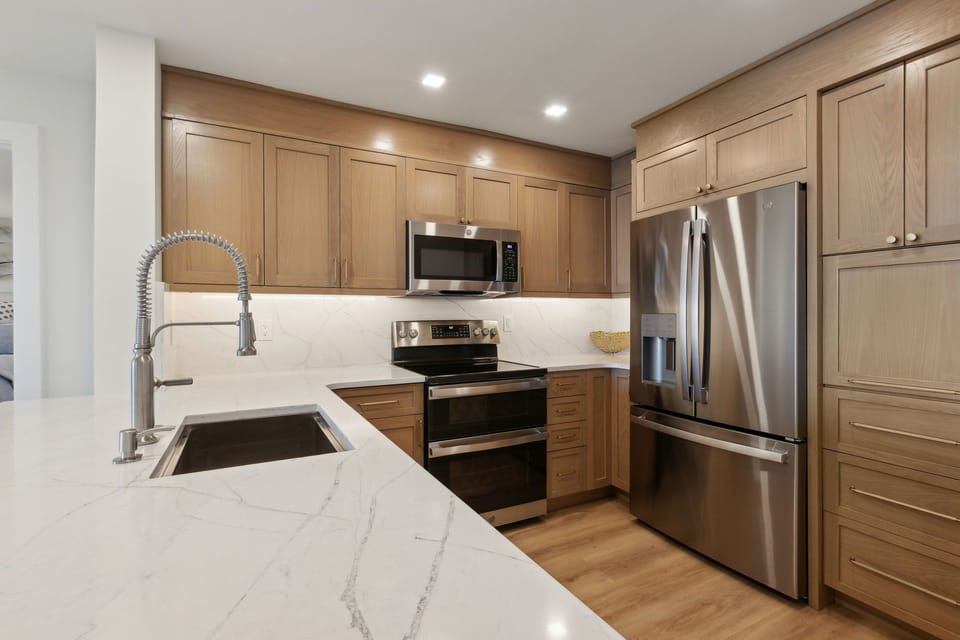 Newly Updated Kitchen with Quartz Countertops, Stainless Steel Appliances, and Stunning White Oak Cabinets