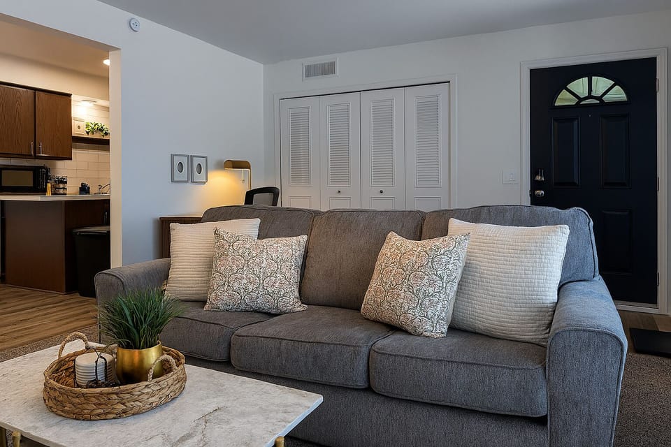 Spacious living area with plush seating and easy access to the kitchen.