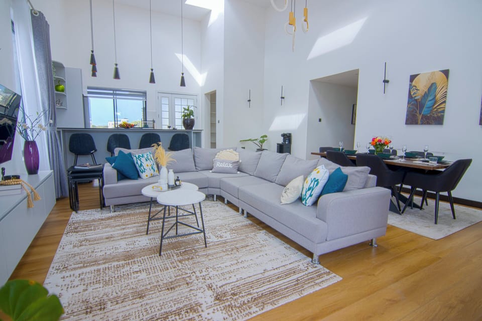Luxury Bungalow, Garden View | Living area | 32-inch TV with digital channels