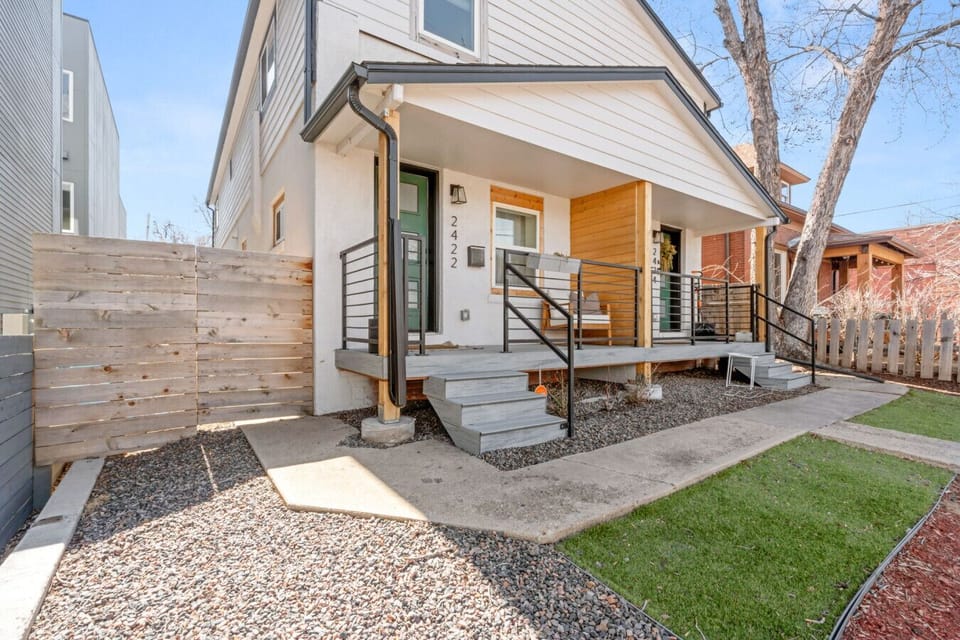 Fully fenced yard with patio, outdoor seating, and gas fire pit