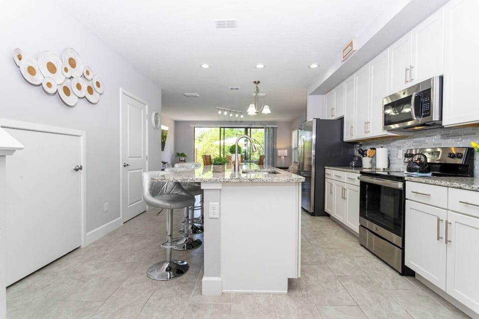Fall in love for modern luxury with our stunning open kitchen—a beautiful, vibrant space that seamlessly combines style and functionality. a family-friendly retreat where the joy of cooking meets the warmth of togetherness.
