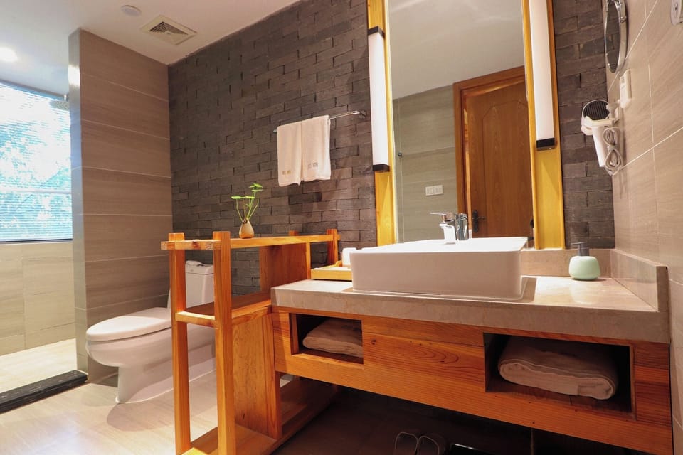 Exclusive Duplex, Courtyard View | Bathroom | Hair dryer, bathrobes, slippers, towels